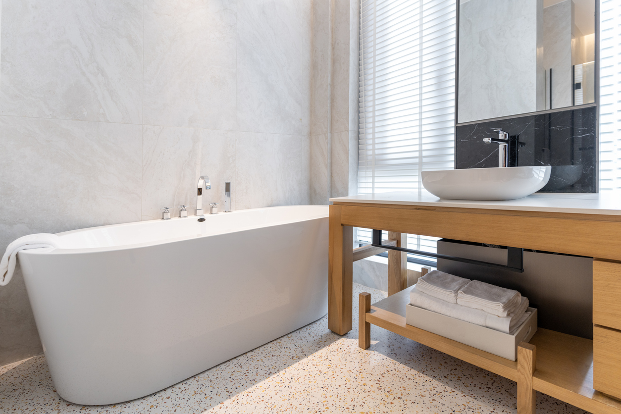 Spacious and bright washroom sink and bathtub